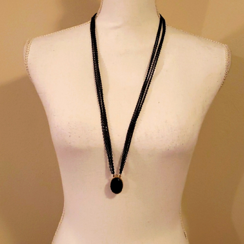 Long black and gold necklace